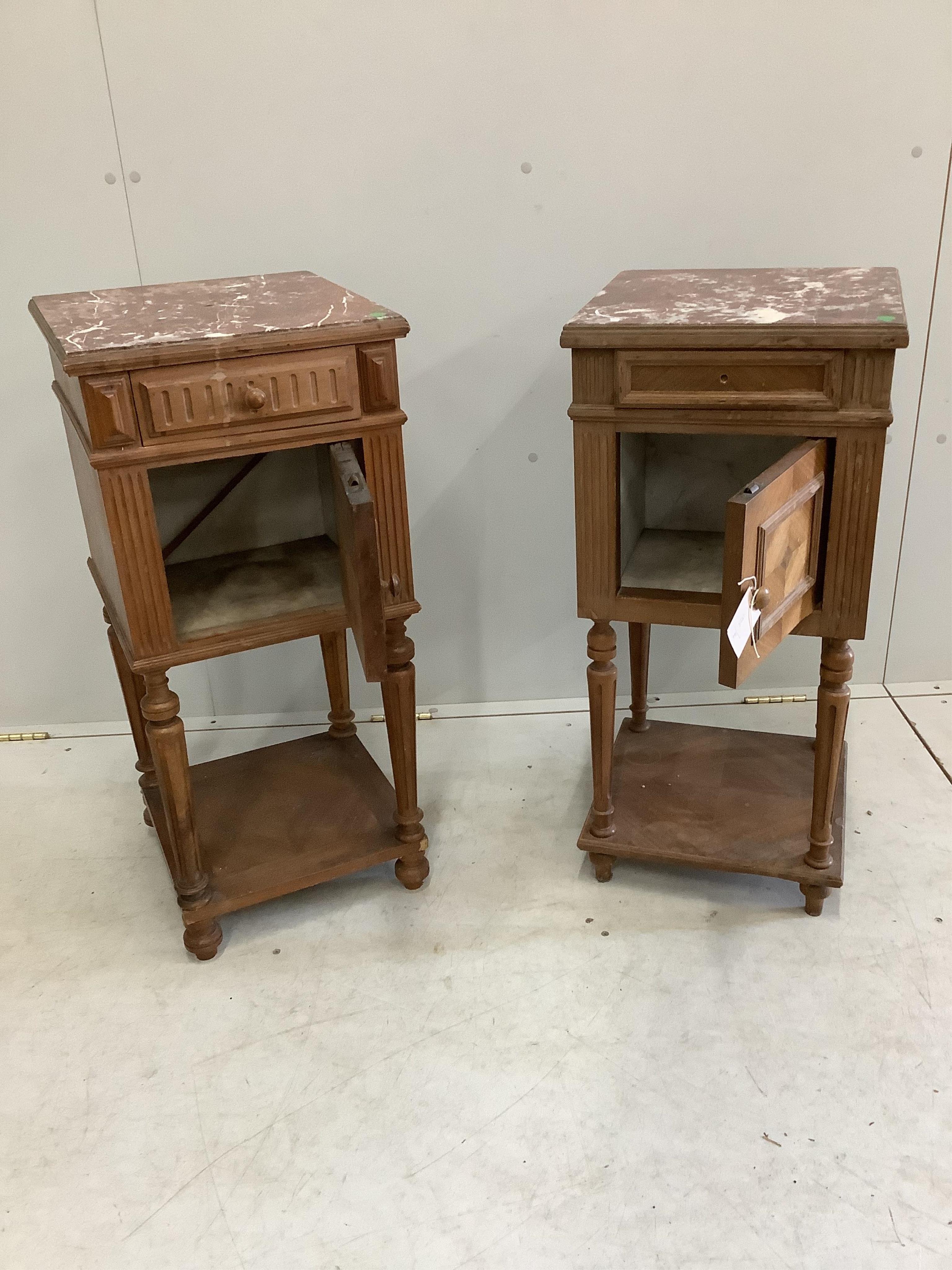 A near pair of late 19th or early 20th century French walnut marble top bedside cabinets, larger width 36cm, depth 36cm, height 80cm. Condition - fair